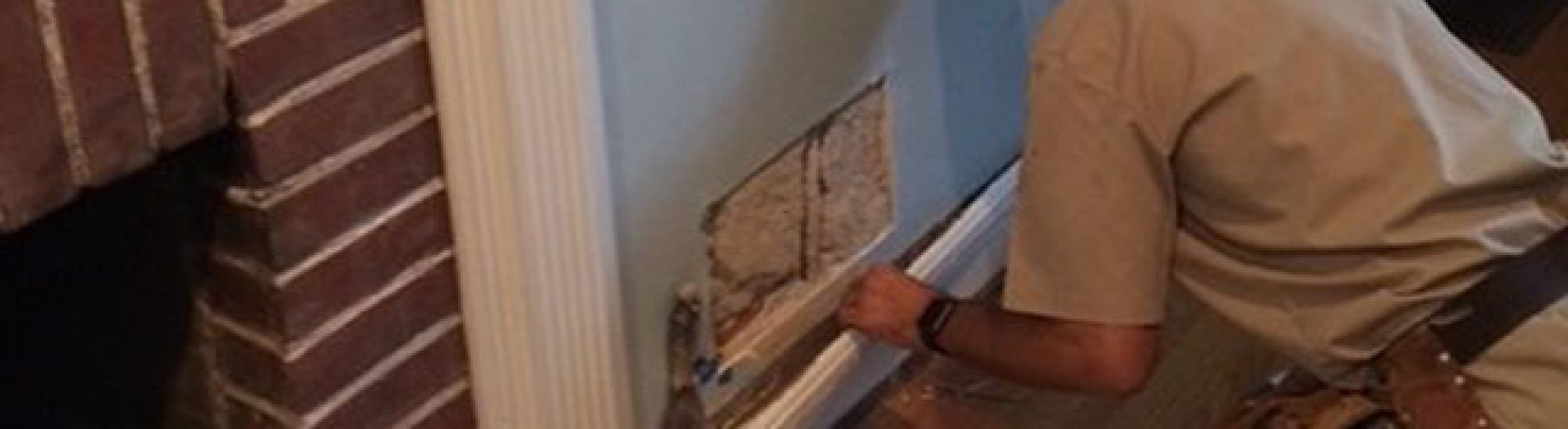 Aaron Carmack leaning against his service van